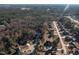 Aerial view of a neighborhood with single Gathering homes surrounded by trees at 40 Ringneck Ct, Lillington, NC 27546