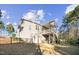 Home exterior shows a covered deck, gray siding, and a secure fenced-in yard at 40 Ringneck Ct, Lillington, NC 27546