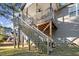 Elevated deck shows spacious design and durable wooden construction, steps to backyard at 40 Ringneck Ct, Lillington, NC 27546