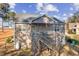 Inviting two-story home features a spacious wooden deck and backyard with a black aluminum fence at 40 Ringneck Ct, Lillington, NC 27546