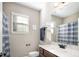 Well-lit bathroom featuring a marble countertop, updated fixtures, and a window for natural light at 40 Ringneck Ct, Lillington, NC 27546