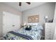 Bedroom featuring a floral patterned quilt, soft carpet, and ample closet space at 40 Ringneck Ct, Lillington, NC 27546