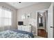 Bedroom featuring a floral patterned quilt, soft carpet, and view to the next room at 40 Ringneck Ct, Lillington, NC 27546