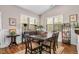 Dining room with wood table and chairs, bright windows and beautiful wainscoting at 40 Ringneck Ct, Lillington, NC 27546