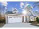 Charming two-story home featuring an attached garage and a covered front porch at 40 Ringneck Ct, Lillington, NC 27546