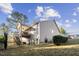 Two story home featuring a fenced in yard, an outdoor wooden deck, and gray siding at 40 Ringneck Ct, Lillington, NC 27546