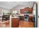 Well-equipped kitchen with stainless steel appliances, wood cabinets, and granite countertops at 40 Ringneck Ct, Lillington, NC 27546
