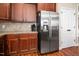 Kitchen with stainless steel appliances, wood cabinets, and a spacious refrigerator at 40 Ringneck Ct, Lillington, NC 27546