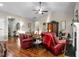 Bright and airy living room with hardwood floors, high ceilings, and ample seating at 40 Ringneck Ct, Lillington, NC 27546