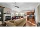 Open-concept living area featuring a fireplace, comfortable seating, and seamless flow to the kitchen at 40 Ringneck Ct, Lillington, NC 27546