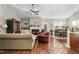 Open-concept living room with a fireplace, seamlessly connecting the kitchen and dining area at 40 Ringneck Ct, Lillington, NC 27546