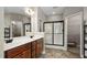Main bathroom featuring double vanity, tile floors, and a glass-enclosed shower at 40 Ringneck Ct, Lillington, NC 27546
