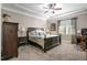 Bedroom with a decorative tray ceiling, ceiling fan and neutral carpeting at 40 Ringneck Ct, Lillington, NC 27546