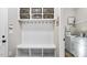 Mudroom with built-in storage, hooks and baskets and access to laundry room at 40 Ringneck Ct, Lillington, NC 27546