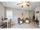 Comfortable sitting area featuring cozy chairs, a table, and a window for natural light at 40 Ringneck Ct, Lillington, NC 27546