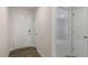 A bright entryway features wood-look flooring and a view into the adjacent carpeted room at 401 Citron St, Sanford, NC 27332