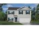 Charming two-story home featuring a two-car garage and well manicured front lawn at 405 Citron St, Sanford, NC 27332