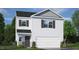 Charming two-story home with a welcoming front yard and attached two-car garage at 409 Citron St, Sanford, NC 27332