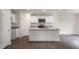 Modern kitchen featuring a central island, granite countertops, and ample cabinet space at 409 Citron St, Sanford, NC 27332