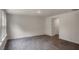 Spacious living room with neutral walls and access to other rooms at 409 Citron St, Sanford, NC 27332