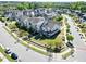Aerial view of neighborhood featuring sidewalks, townhomes, green space and tree lined streets at 4137 Strendal Dr, Cary, NC 27519