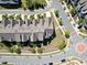 Aerial view of residential neighborhood showing townhomes with landscaped yards at 4137 Strendal Dr, Cary, NC 27519