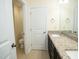 Bathroom featuring a granite countertop vanity with double sinks and access to a private toilet area at 4137 Strendal Dr, Cary, NC 27519
