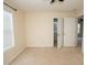 Bright bedroom featuring neutral carpeting, trim, and walls, and two open doorways leading to other rooms at 4137 Strendal Dr, Cary, NC 27519