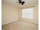Carpeted bedroom with a ceiling fan and a window with blinds for natural light at 4137 Strendal Dr, Cary, NC 27519