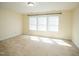 Bright bedroom featuring three large windows at 4137 Strendal Dr, Cary, NC 27519