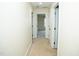 Hallway with carpeted floors, open doorways with views of the bathroom, stairway, and rooms at 4137 Strendal Dr, Cary, NC 27519