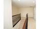 Upstairs hallway featuring decorative iron railing, neutral paint, carpet, and recessed lighting at 4137 Strendal Dr, Cary, NC 27519