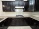 This kitchen shows granite countertops and stainless steel gas range at 4137 Strendal Dr, Cary, NC 27519