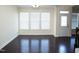 Bright living room featuring hardwood floors, natural light, and a welcoming ambiance at 4137 Strendal Dr, Cary, NC 27519