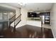Open floor plan with living room, kitchen, and staircase with wood floors at 4137 Strendal Dr, Cary, NC 27519