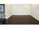Spacious living room features hardwood floors, white trim, and neutral paint creating a bright atmosphere at 4137 Strendal Dr, Cary, NC 27519