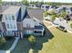 Desirable townhome showcasing a manicured lawn, covered porch, and welcoming front entrance at 4137 Strendal Dr, Cary, NC 27519