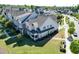 Beautiful townhome featuring a well-maintained lawn, a back porch, and charming architectural details at 4137 Strendal Dr, Cary, NC 27519