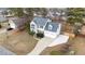 Aerial view of a two-story home with an attached garage in a residential community at 415 Moonlight Dr, Fuquay Varina, NC 27526