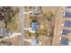 A birdseye view of the house showing landscaping, a fire pit, and a backyard shed at 415 Moonlight Dr, Fuquay Varina, NC 27526