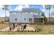 Backyard with a fire pit and seating, ideal for outdoor gatherings and relaxation at 415 Moonlight Dr, Fuquay Varina, NC 27526