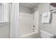 Bathroom featuring a shower/tub combo with white tile surround at 415 Moonlight Dr, Fuquay Varina, NC 27526
