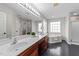 Bathroom featuring double sinks, a soaking tub, and a separate shower at 415 Moonlight Dr, Fuquay Varina, NC 27526