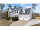 Charming two-story home with an attached two-car garage and beautiful landscaping at 415 Moonlight Dr, Fuquay Varina, NC 27526