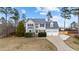 Charming two-story home with a well-manicured lawn and attached two car garage at 415 Moonlight Dr, Fuquay Varina, NC 27526