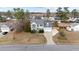 Stately two-story home featuring a manicured lawn, mature trees and long driveway at 415 Moonlight Dr, Fuquay Varina, NC 27526