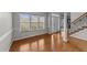 Bright Foyer with Hardwood Floors and view into Living Room with many windows at 415 Moonlight Dr, Fuquay Varina, NC 27526