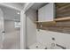 Mudroom with a custom feature wall, washer dryer hookups, and storage cabinets at 415 Moonlight Dr, Fuquay Varina, NC 27526