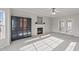 Sun-filled living room with fireplace, ceiling fan and french doors leading to backyard at 415 Moonlight Dr, Fuquay Varina, NC 27526