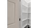Spacious walk-in pantry with plenty of shelving for organized storage at 415 Moonlight Dr, Fuquay Varina, NC 27526